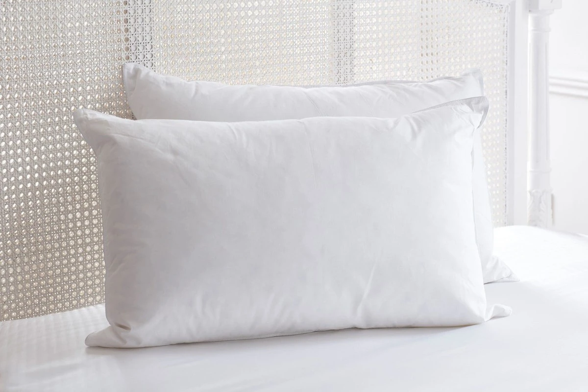 4 oreillers sur votre lit d'hôtel : l'astuce cachée pour votre dos - image 1